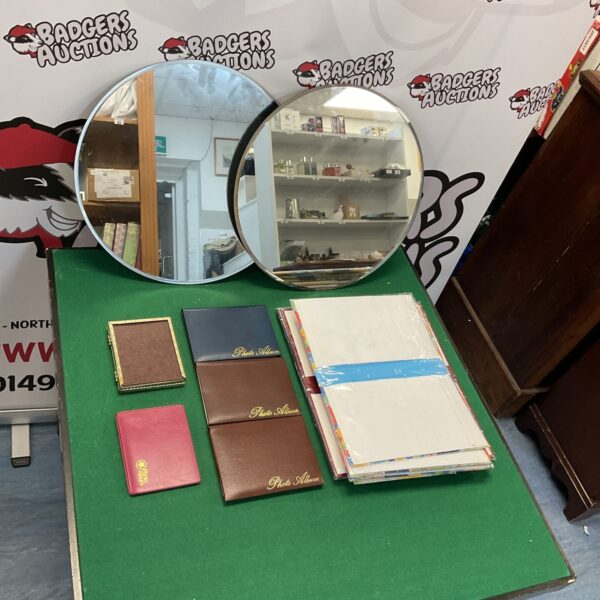 Vintage photo album collection with various styles and sizes.