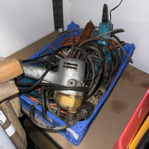 Vintage electric drill, showing signs of wear and age.