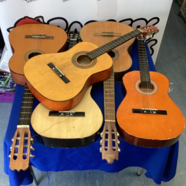 Lot of five vintage acoustic guitars needing repair and restoration.