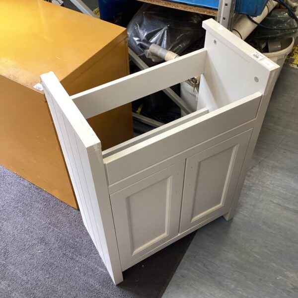 White cloakroom vanity unit for small bathroom storage.
