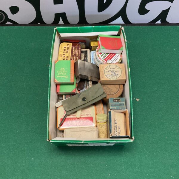 Lot of vintage chemist boxes with colourful branding.