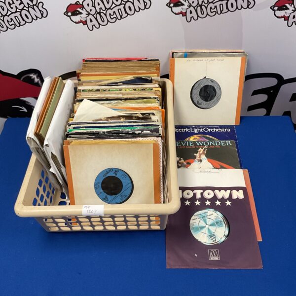 Vintage 7 inch vinyl records in a collection lot.