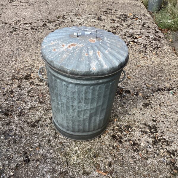 Weathered vintage galvanised dust bin with lid.