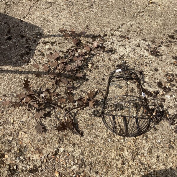 Pair of vintage wrought iron garden wall flower holders.