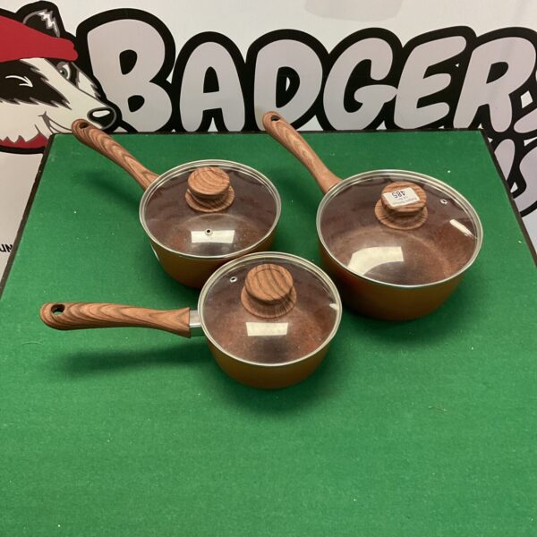 Grey non-stick saucepan set with handles, kitchen cookware.