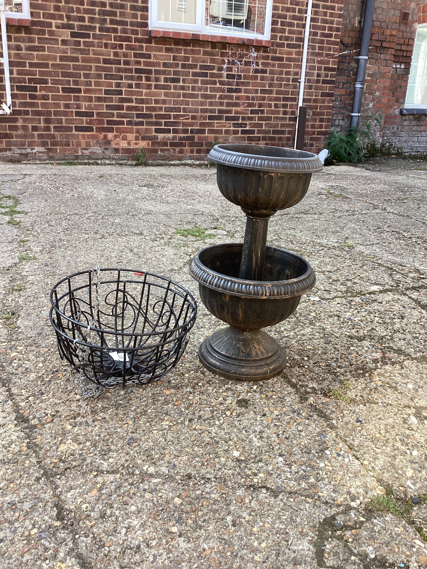 1206 Two hanging baskets and a flower pot stand