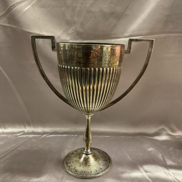 Antique Victorian silverplate walking trophy with ornate handles.