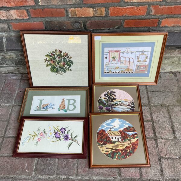 Set of six vintage framed floral embroideries for wall decor.