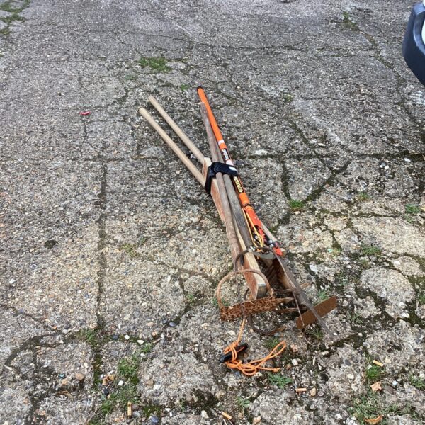 Vintage garden tool bundle with draw hoe and pitchfork.