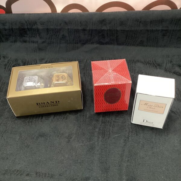 Perfume collection featuring Christian Dior and Brand Collection bottles.