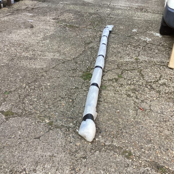 Rolled up large cinema screen for film projection.