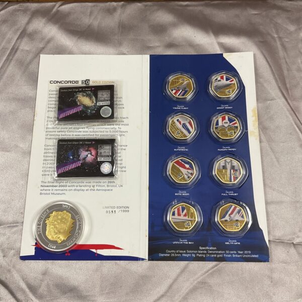 Concorde 50 Gold Coin Collection with space dust samples, aviation collectible.