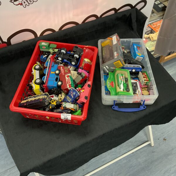 Two boxes filled with a diverse collection of diecast cars.