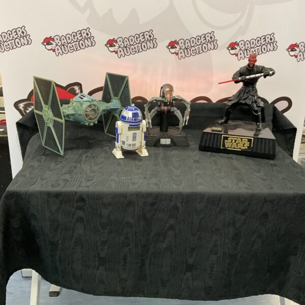 Star Wars collectibles lot featuring R2-D2 clock and models.
