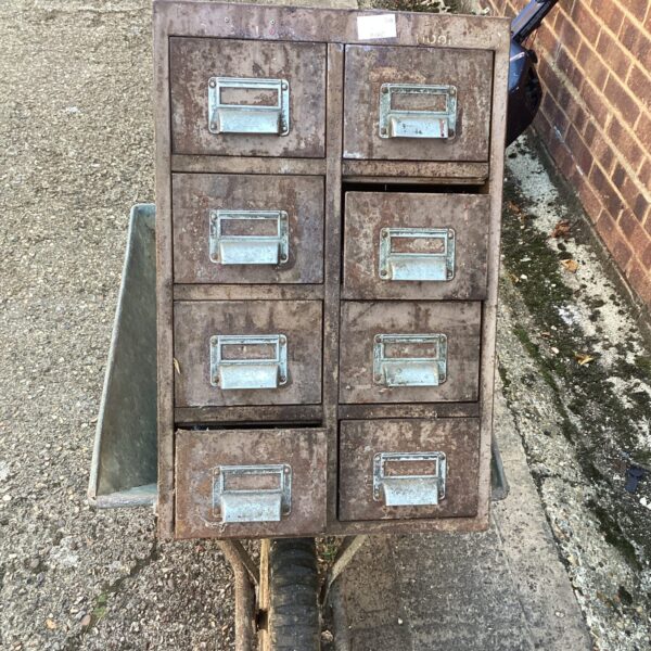 Vintage metal engineering toolbox on a wheel, ideal for tool storage.
