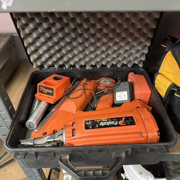 Paslode cordless staple gun kit with batteries and charger.