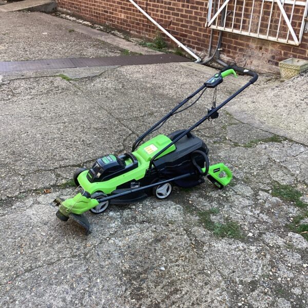 Greenworks cordless mower and strimmer combo for garden maintenance.