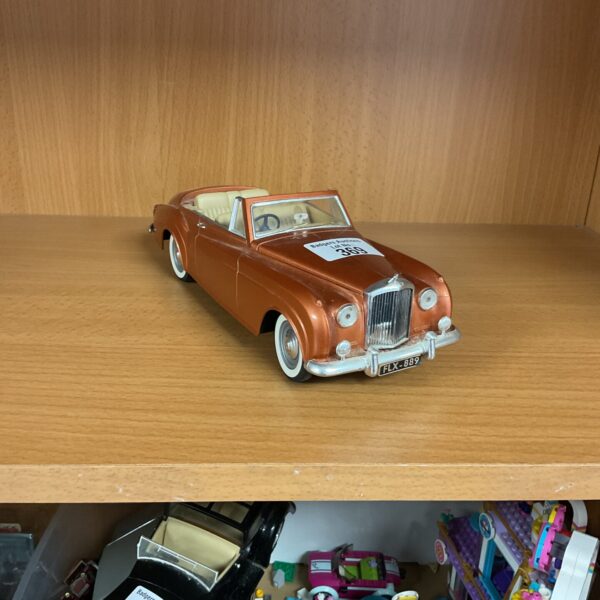 Detailed 1961 Bentley diecast model car on display.