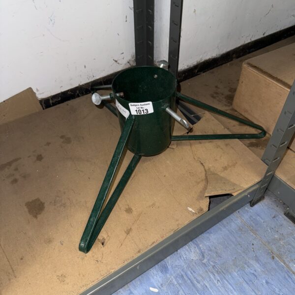 Vintage metal Christmas tree stand with three legs.