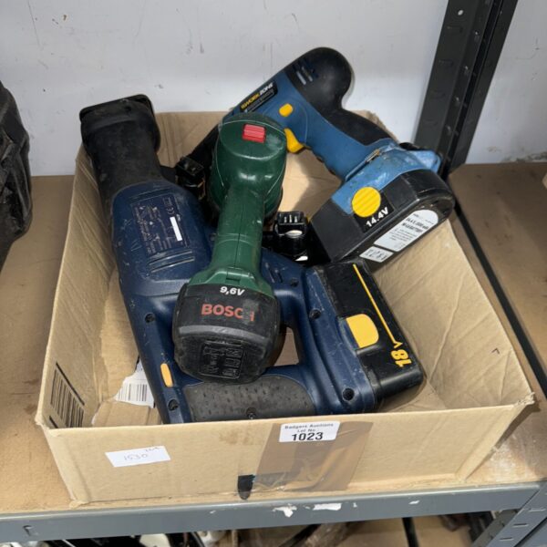 Bosch 14.4V cordless drill in a box of tools.