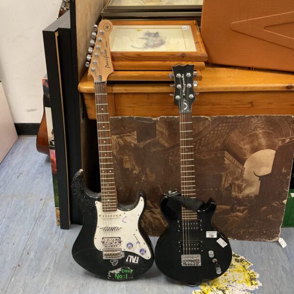 Two electric guitars, including a Yamaha Pacifica, in a lot.