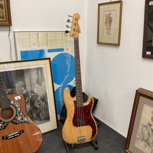 Sunburst Fender Precision Bass Guitar, vintage electric bass instrument.