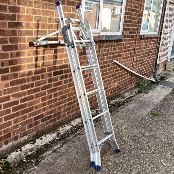 Extendable aluminium ladder with stand-off mechanism for roof access.