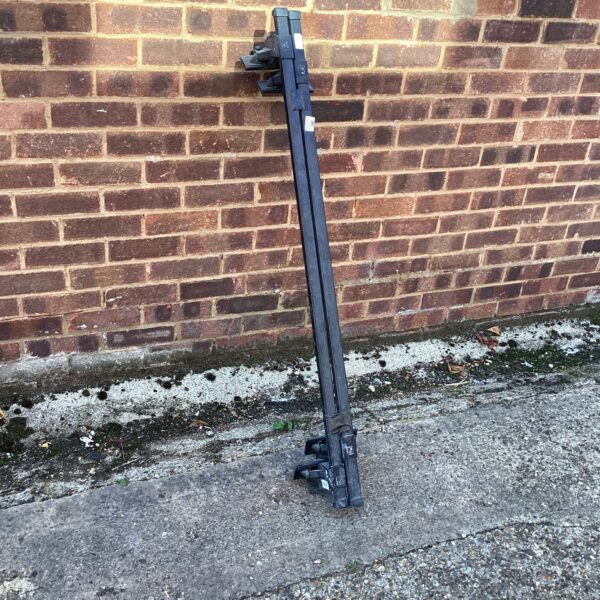 Set of used Thule roof bars for vehicle roof rack.