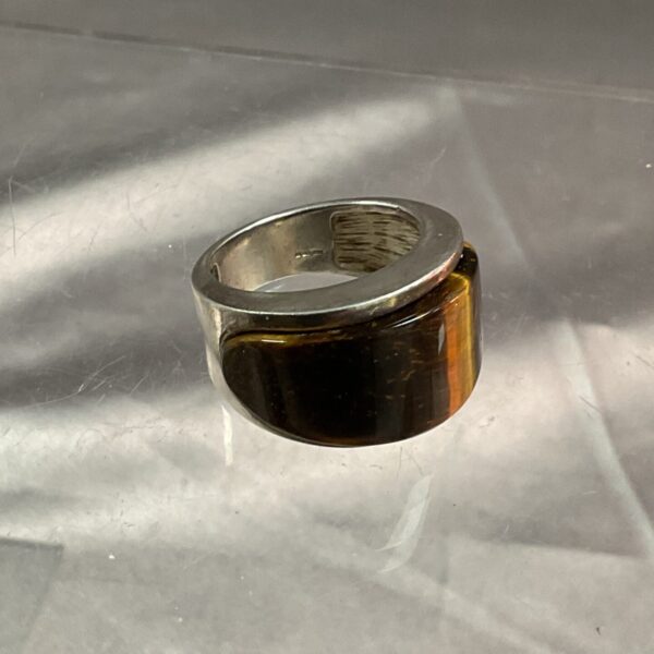 Close-up of a heavy silver tigers eye ring.