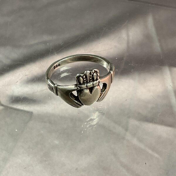 Vintage Irish silver ring with heart in hands design.