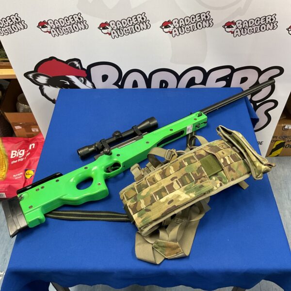 CO2 airsoft rifle with scope and army belt displayed.