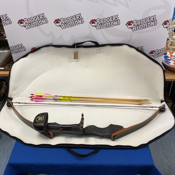 Vintage Howatt Warthog compound bow with arrows and case.