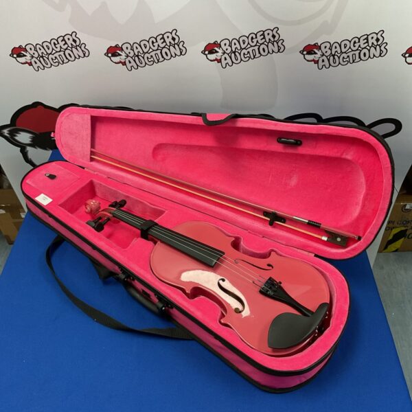 Pink gear4music violin inside its open case.