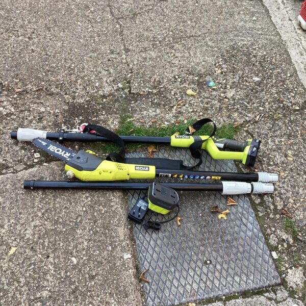 Ryobi ONE+ pole saw with battery and charger for garden maintenance.