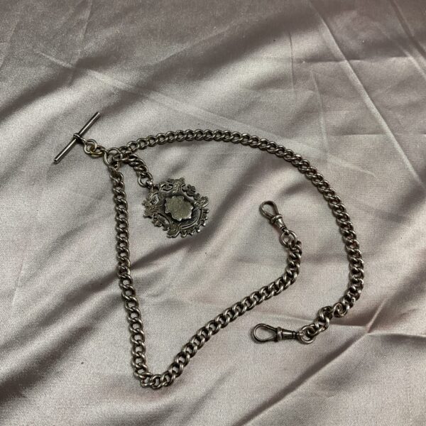 Antique silver Albert chain with decorative fob and T-bar.