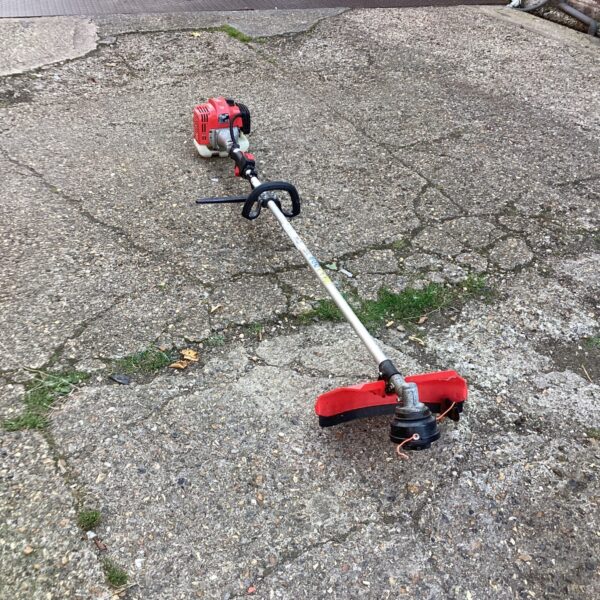 JDW petrol strimmer for garden maintenance and lawn trimming.