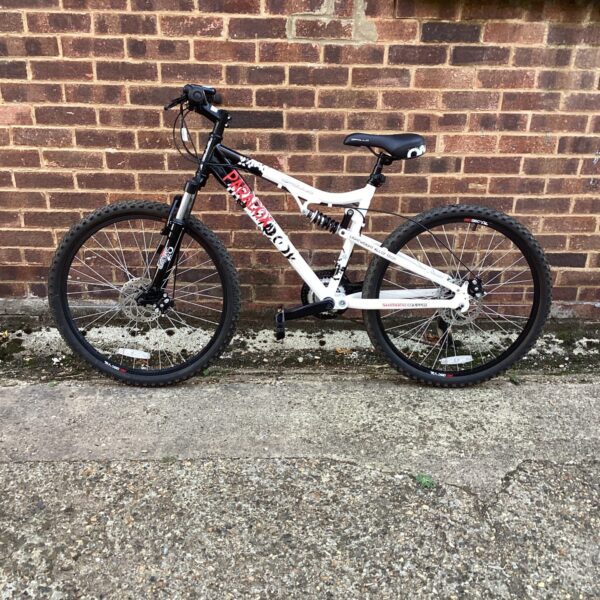 Used Apollo Paradox mountain bike in white and black.