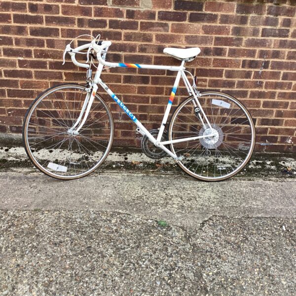 Vintage Peugeot racing bike in a classic French style.