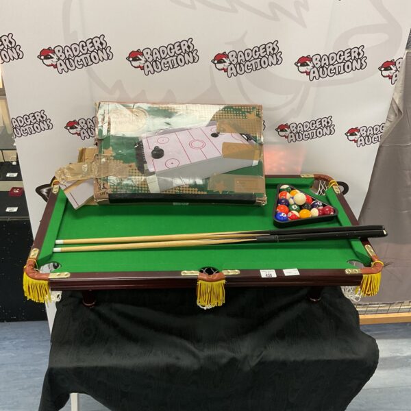 Combined mini snooker and air hockey table for tabletop games.