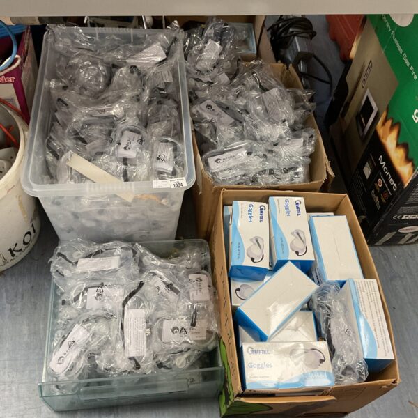 Lot of four boxes filled with clear protective goggles.