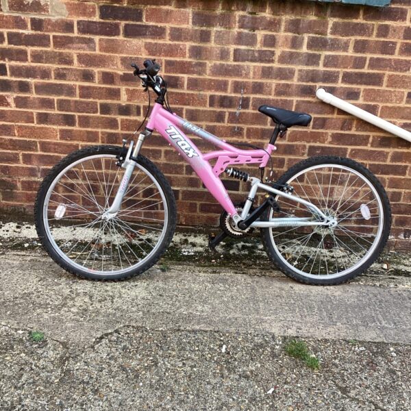 Pink Trax TFS1 mountain bike with suspension fork.