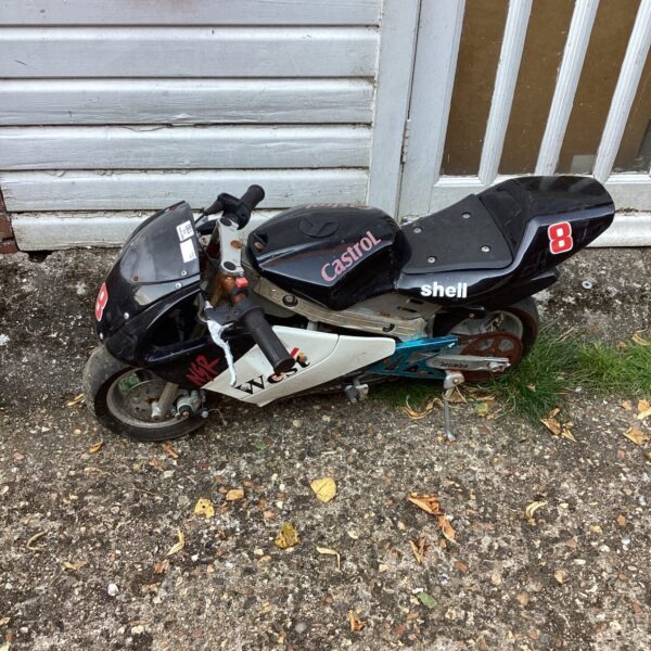 Red and white mini motorbike for sale, a small pocket bike.