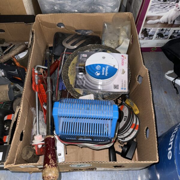 Mixed tool lot with screwdrivers, charger, and safety alarm.