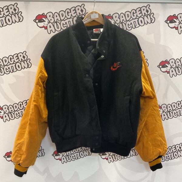 Vintage 90s Nike ‘Just Do It’ jacket in black and yellow.