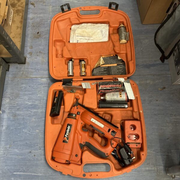 Large Paslode cordless staple gun in its original carrying case.