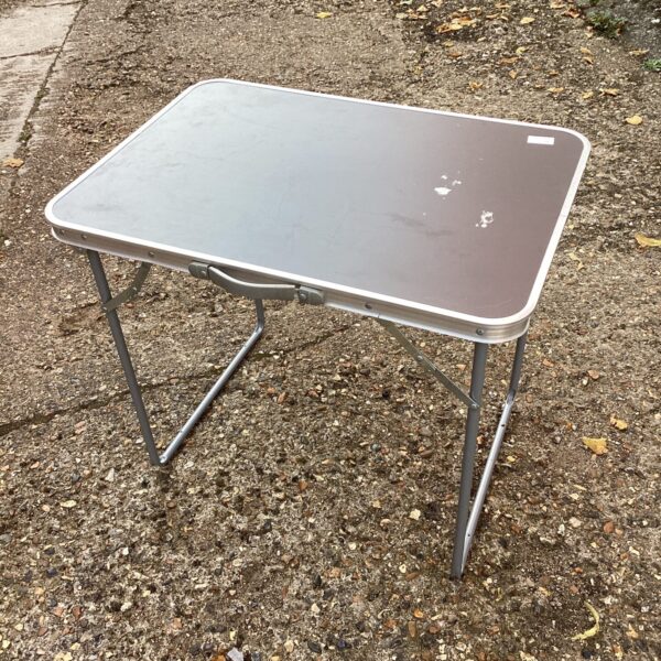 Portable folding picnic table for outdoor use.