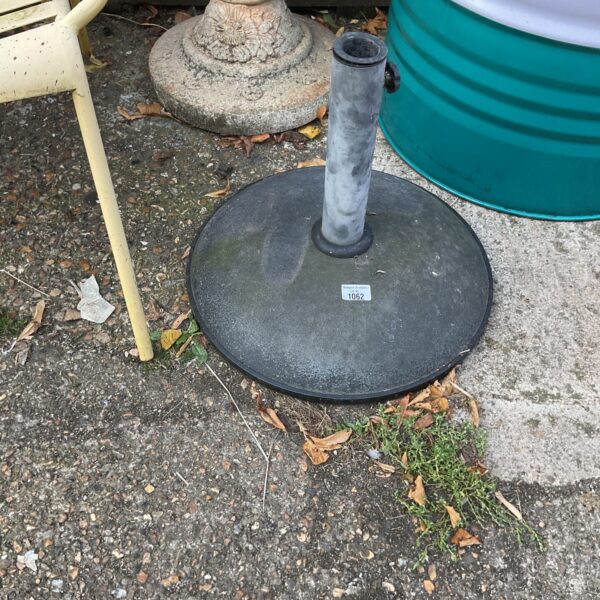 Heavy-duty metal parasol base for garden umbrellas.