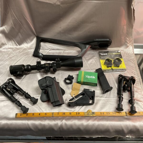 Mixed lot of gun accessories including bipod and scope mounts.