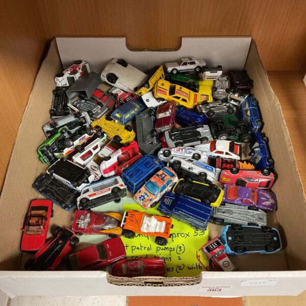 A tray of diverse diecast model cars, including Matchbox and Corgi brands.