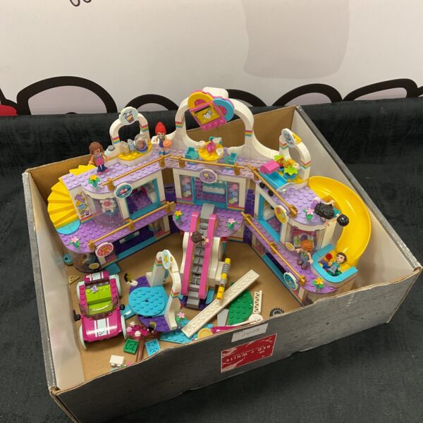 Colourful Lego Friends Amusement Pier playset with figures.